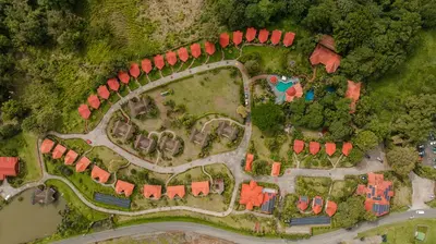 an overhead view of a house with red roofs at Montaña de fuego Mountain Resort & Spa in Fortuna