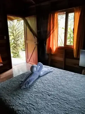a toy octopus laying on a bed in a bedroom at Cataratas Bijagua Lodge, incluye tour autoguiado Bijagua Waterfalls Hike in Bijagua