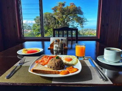 a table with a plate of food on a table at Mar Inn Costa Rica in Monteverde Costa Rica