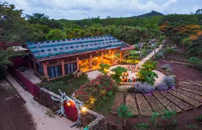 an aerial view of a house with a garden at Latica Lodge in Playa Negra