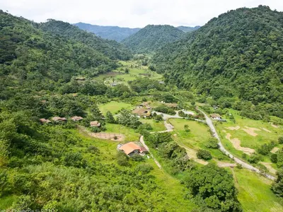 an aerial view of a village in a mountain valley at Rancho Margot Sustainable & Self Sufficient Eco Lodge in El Castillo de La Fortuna
