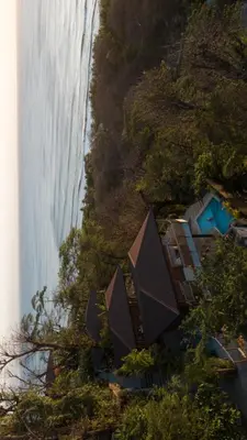 an aerial view of a house next to a waterfall at Vista del Alma Boutique - Adult Only in Santa Teresa Beach