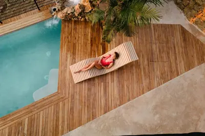 a woman sitting on a raft in a pool at Vista del Alma Boutique - Adult Only in Santa Teresa Beach