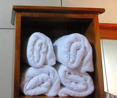 a pile of towels in a wooden box at Nafre House B&B Monteverde in Monteverde Costa Rica