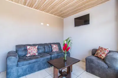 a living room with a couch and a table at Casa Monarca II - Monteverde in Monteverde Costa Rica