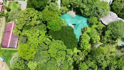 an overhead view of a house surrounded by trees at Tirimbina Rainforest Lodge in Sarapiquí