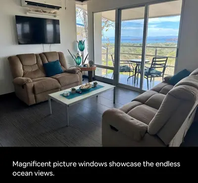 a living room with two couches and a table at Gorgeous Ocean View Private home, 4 bedrooms with en suite, private plunge pool in Coco