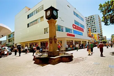 a clock tower in the middle of a street at Hotel Quinta Avenida in San José