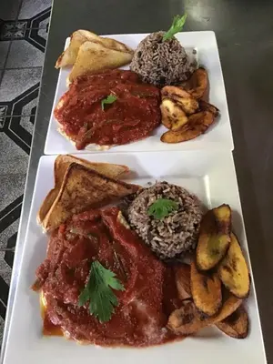a plate of food with different types of food at Isla Violin Eco-Lodge in Isla Violin