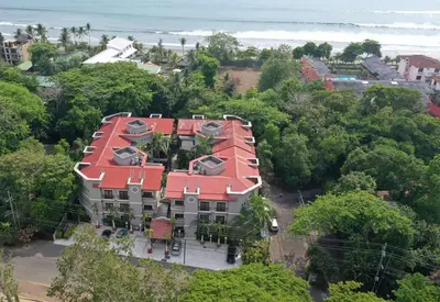 an aerial view of a house with a red roof at Macaws Ocean Club Apartamento # 18 in Jacó