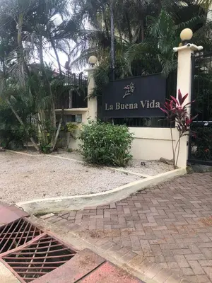 a sign for the la buena vida building at La Buena Vida 2 in Tamarindo