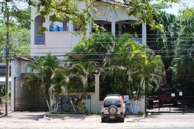 a small car parked in front of a house at La Buena Vida 2 in Tamarindo