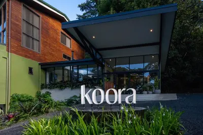 a building with a kroc sign in front of it at Koora Monteverde a Cloud Forest Hotel by Sandglass in Monteverde Costa Rica