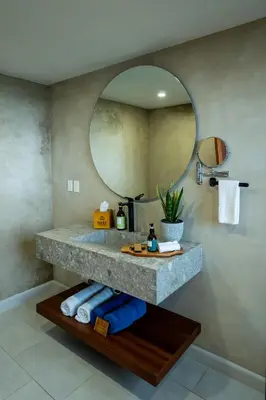 a bathroom with a sink and a mirror at Koora Monteverde a Cloud Forest Hotel by Sandglass in Monteverde Costa Rica