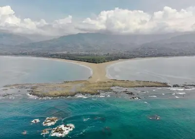an aerial view of an island in the ocean at Hotel Vive Uvita in Uvita