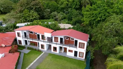 an overhead view of a house with a red roof at Hotel Vive Uvita in Uvita