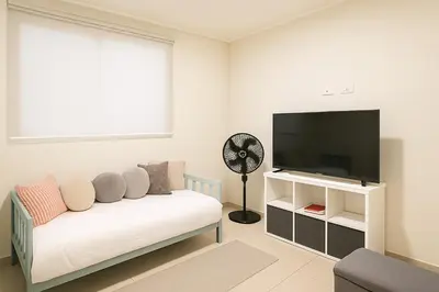 a living room with a couch and a flat screen tv at Costa Rica, San José, Pinares Luxe Apt Near Elite Clinics in San José