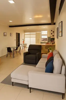 a living room with a couch and a table at Costa Rica, San José, Pinares Luxe Apt Near Elite Clinics in San José