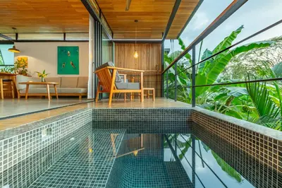 a house with a pool in the middle of a house at The Green House, Santa Teresa - Adults Only in Santa Teresa Beach