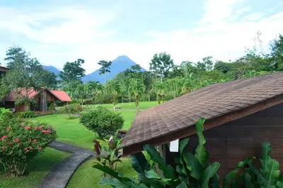 a view of a resort with mountains in the background at Hotel Eco Arenal in Fortuna