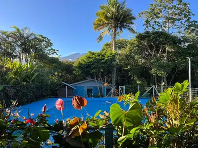 a view of the pool from the garden at Cabañas el Bosque in Turrialba