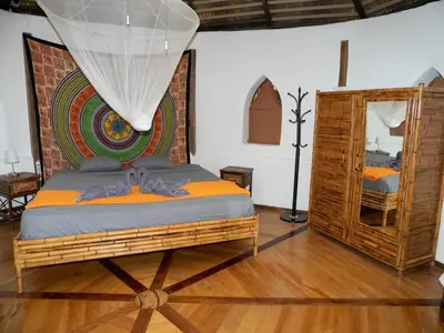 a bedroom with a bed in a room at Casa Romantica in Platanillo