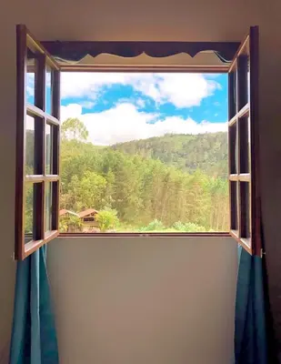 a window with a view of a mountain view at Cabaña Vista Verde in Cartago