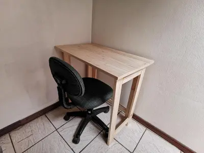 a desk with a chair next to a wall at Cabaña Vista Verde in Cartago