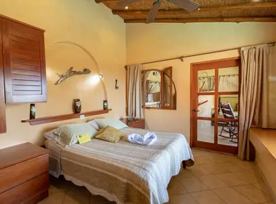 a bedroom with a bed in a room at Villa Mango B&B in Nosara
