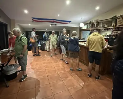 a group of people standing in a kitchen at Costa Rica Guesthouse in San José