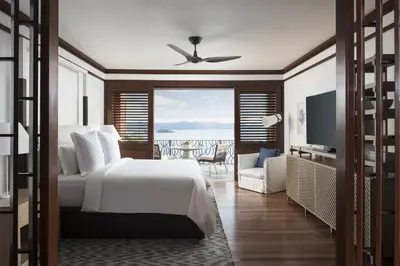 a bedroom with a bed and a view of the ocean at Four Seasons Resort Peninsula Papagayo, Costa Rica in Papagayo, Guanacaste