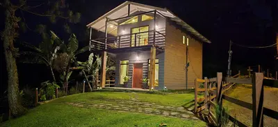 a small house at night with a fence at Monteverde Casa Mia, near main attractions and town! in Monteverde Costa Rica