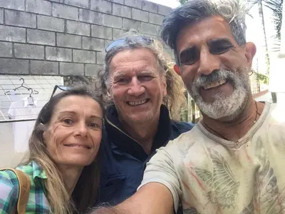 two men and a woman posing for a picture at Salamandra Room in Escazu