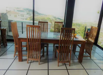 a dining room table and chairs with a view at Salamandra Room in Escazu