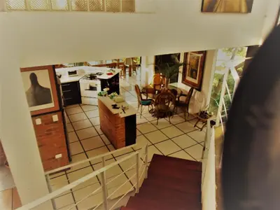 an overhead view of a kitchen and a living room at Salamandra Room in Escazu