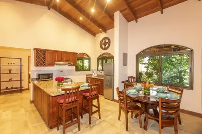 a kitchen and dining room with a table and chairs at 