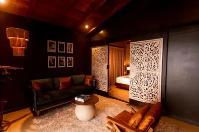a living room with a couch and a bed at Oxygen Jungle Villas & Spa in Uvita