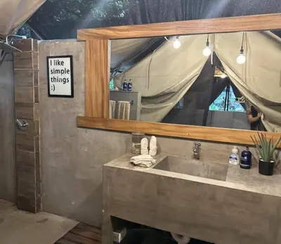 a bathroom with a sink and a mirror at Curiol Boutique Hotel & Lounge in Potrero