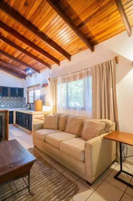a living room with a couch and a table at Curiol Boutique Hotel & Lounge in Potrero