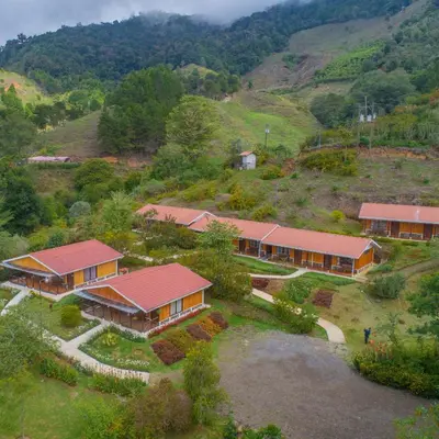 an aerial view of a house on a hill at Hotel de Montaña Suria in San Gerardo de Dota