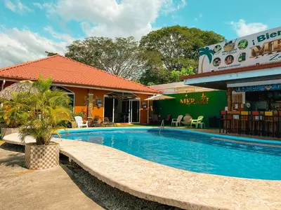 a swimming pool in front of a hotel at Hotel Boutique Meraki in Caldera