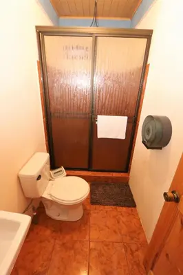 a bathroom with a toilet and a shower at HOUSE CATTLEYA monteverde in Monteverde Costa Rica