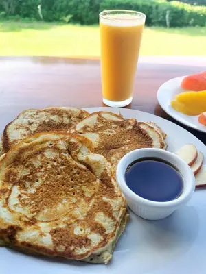a plate of toast and a glass of orange juice at Casitas de Montaña Cabuya in Monteverde Costa Rica