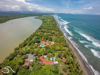 an aerial view of the shoreline of a beach at Tranquilidad Resort in Parrita