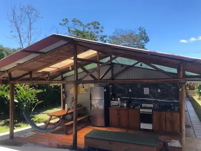 a pavilion with a kitchen on a deck at Le Petit Hotel in Fortuna