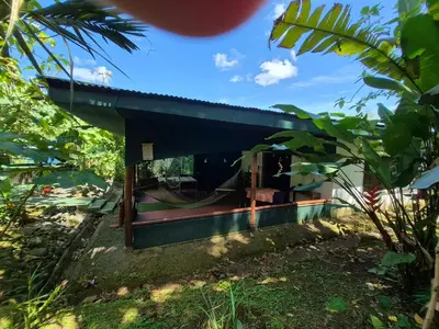 a house in the middle of a garden at Centro Ananda, Cabina, Bambuszelt in Guápiles