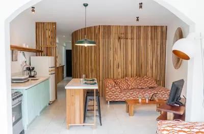 a living room with a couch and a table at Plaza Royal Apartments in Santa Teresa Beach