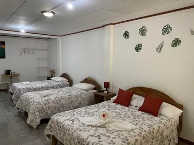 a hotel room with two beds in a room at Globi lodge #2 in Monteverde Costa Rica
