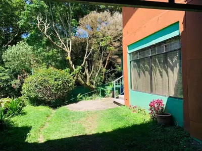 a house with a window on the side of it at Globi Lodge #3 in Monteverde Costa Rica
