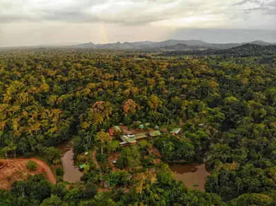 an aerial view of a house in the middle of a forest at La Laguna del Lagarto Eco-Lodge in Pital